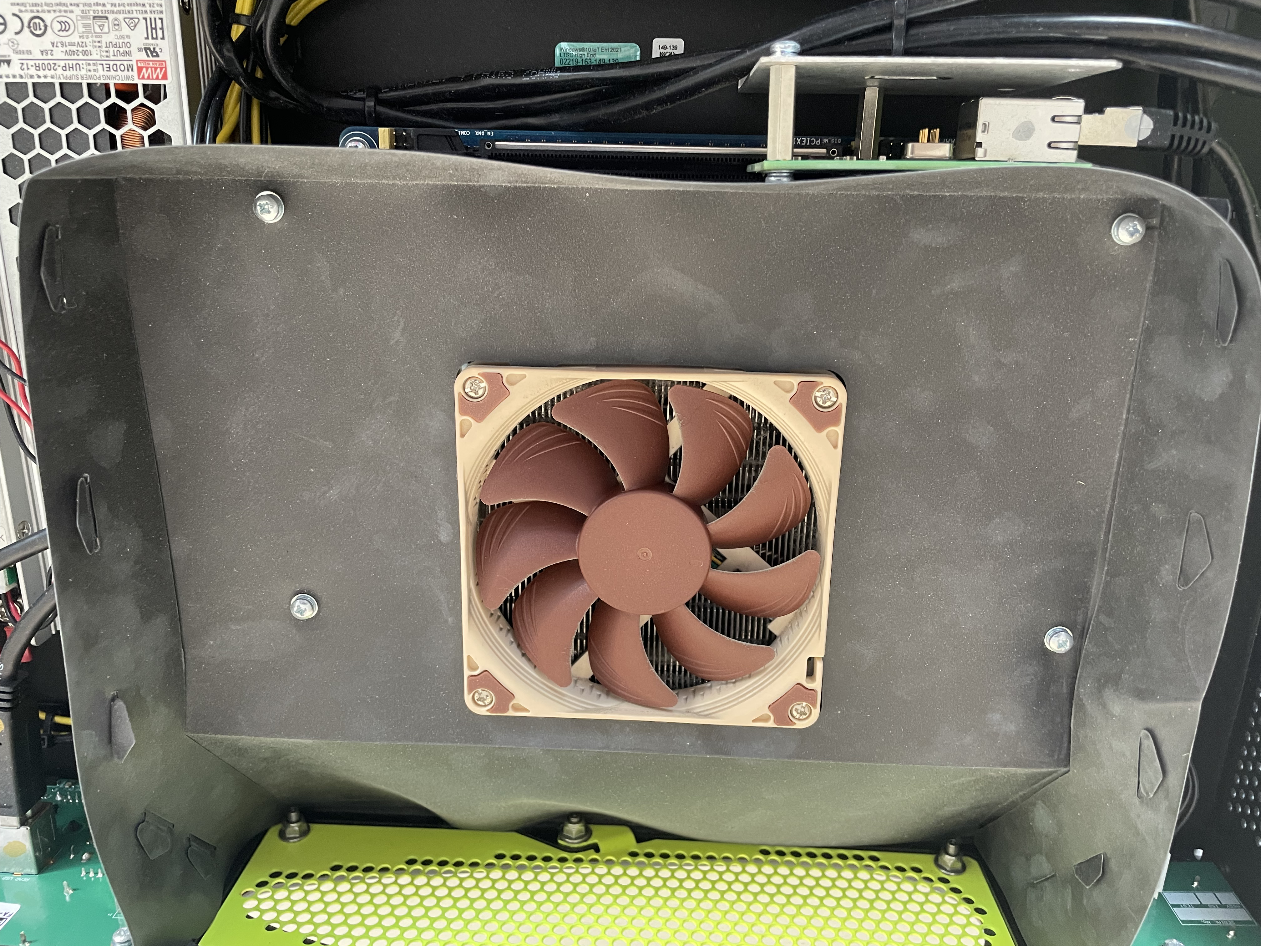 The four screws securing the air duct assembly